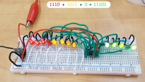 A Computer Engineering student project of a breadboard with a binary addition circuit on it.