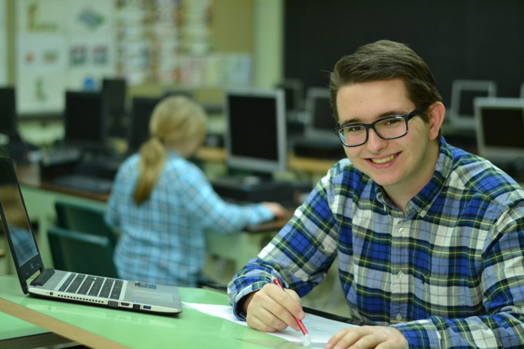 Student at a drafting table